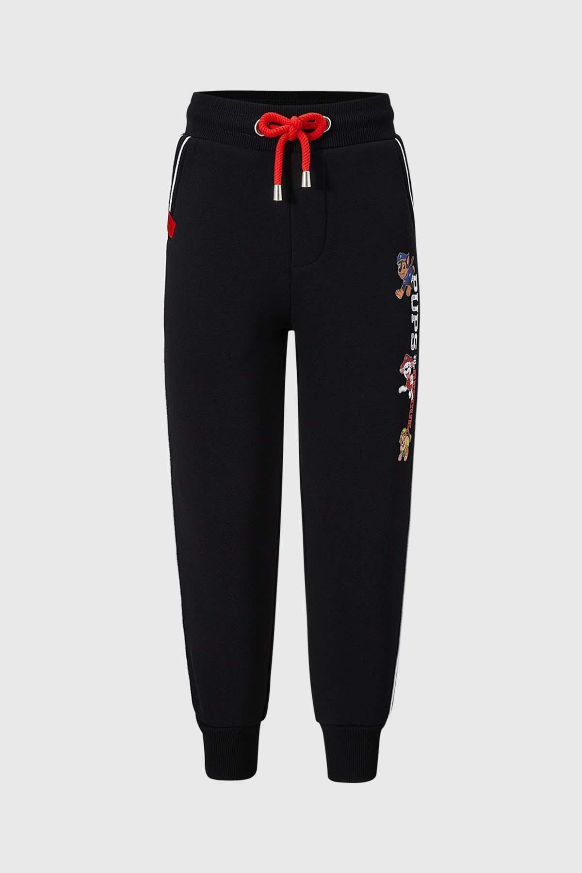 Pantalon buzo negro para niño con diseño de Paw Patrol y detalles en rojo.