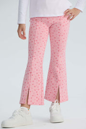 Calza rosada con estampado de corazones para niña