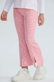 Calza rosada con estampado de corazones para niña