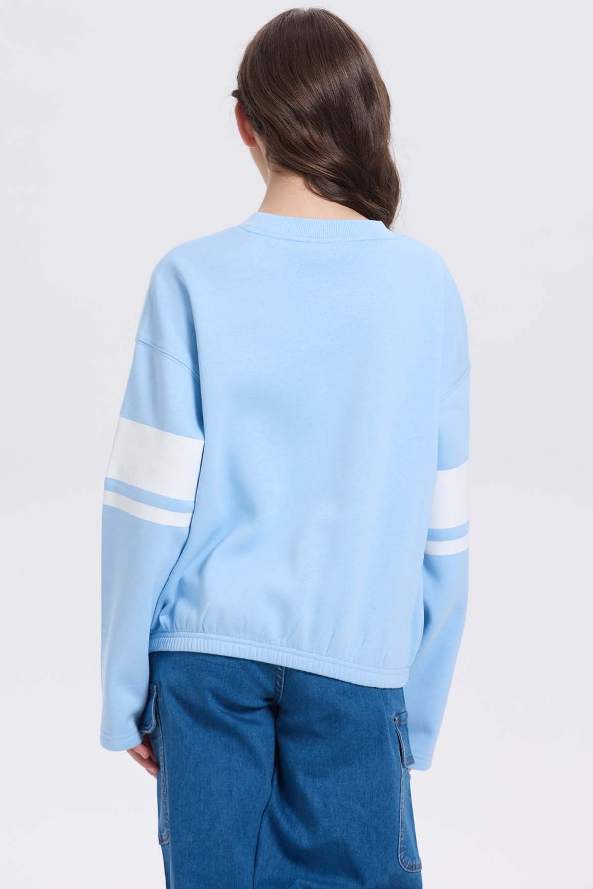 Polerón niña print posicional celeste