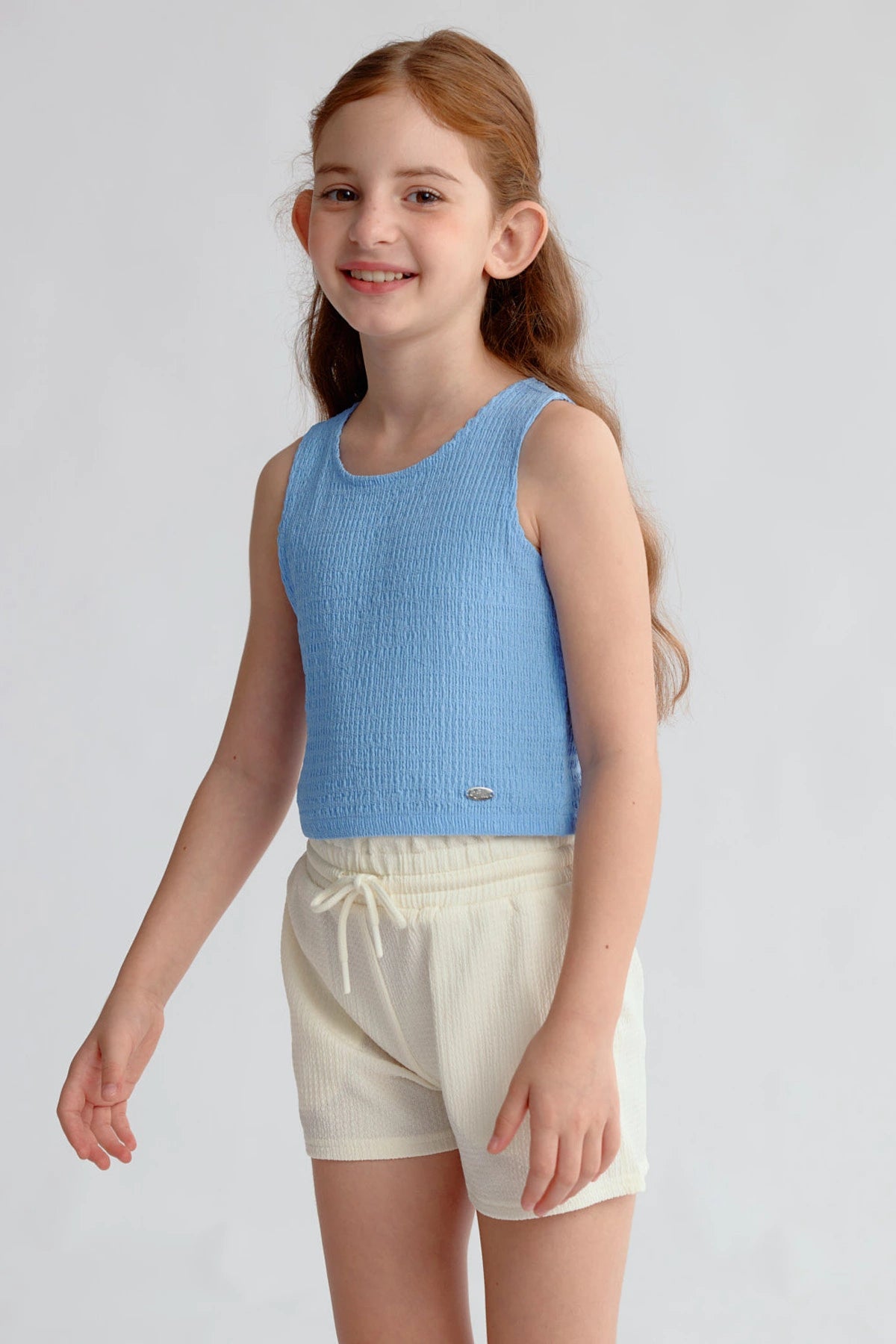 Polera Niña Textura Tipo Peto Celeste