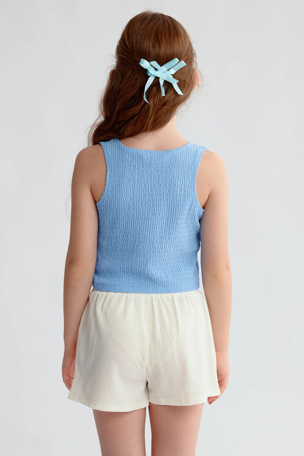 Polera Niña Textura Tipo Peto Celeste