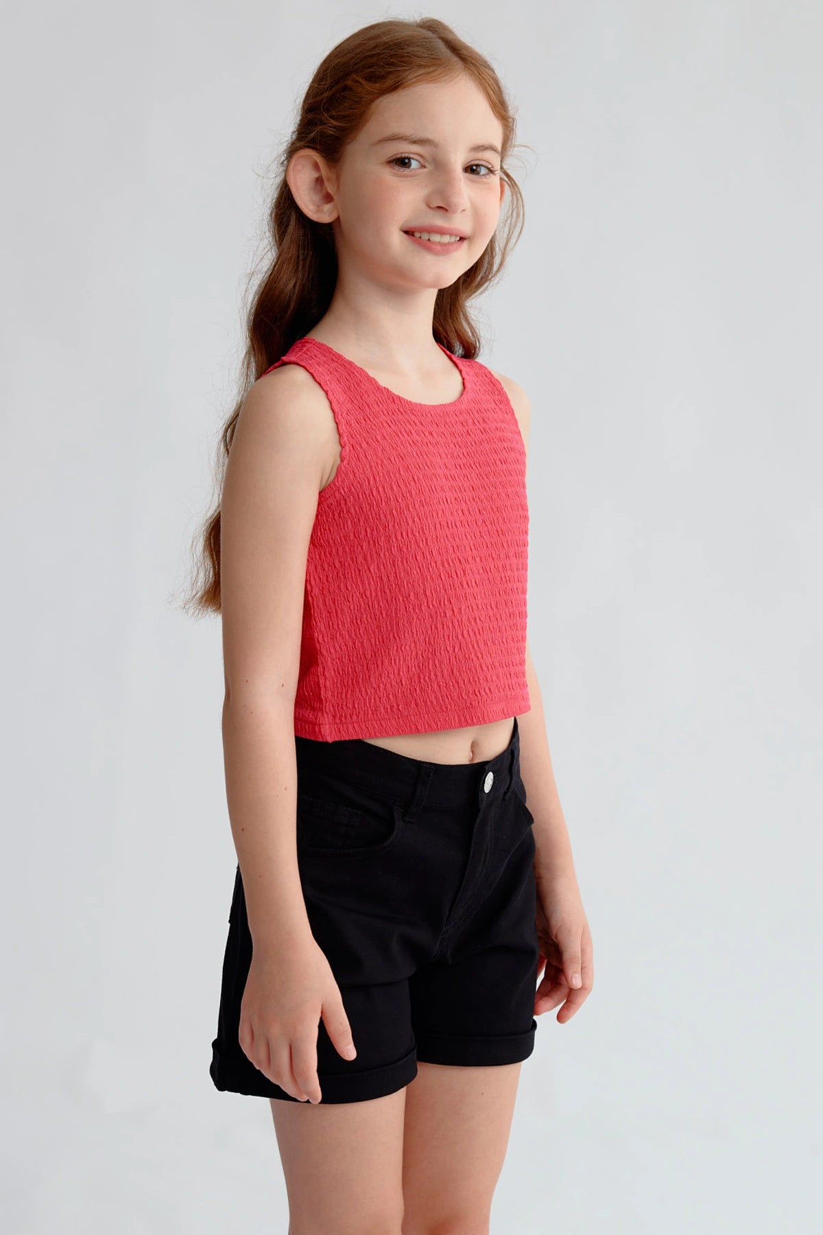 Polera Niña Textura Tipo Peto Fucsia