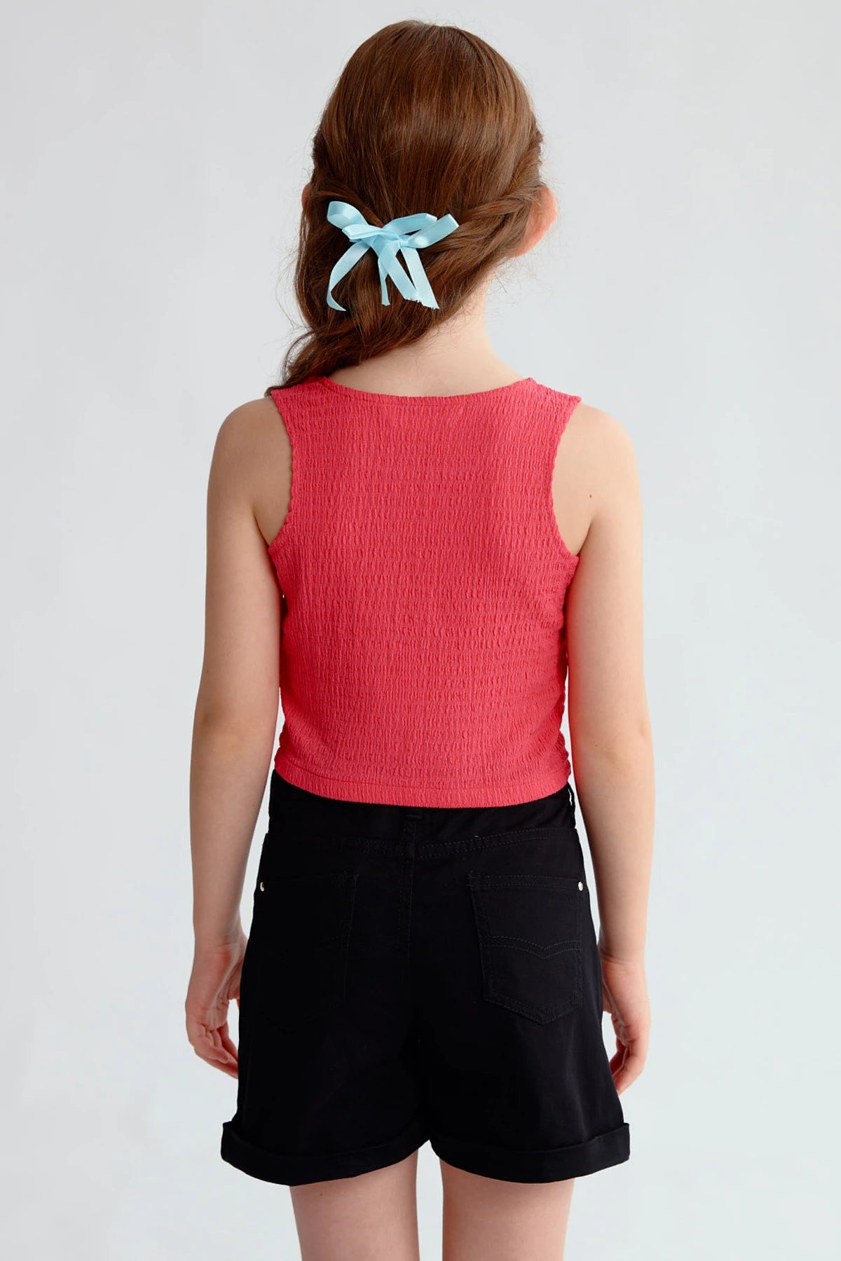 Polera Niña Textura Tipo Peto Fucsia