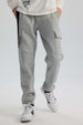 Pantalón Buzo Niño Cortes Bolsillo Gris Melange