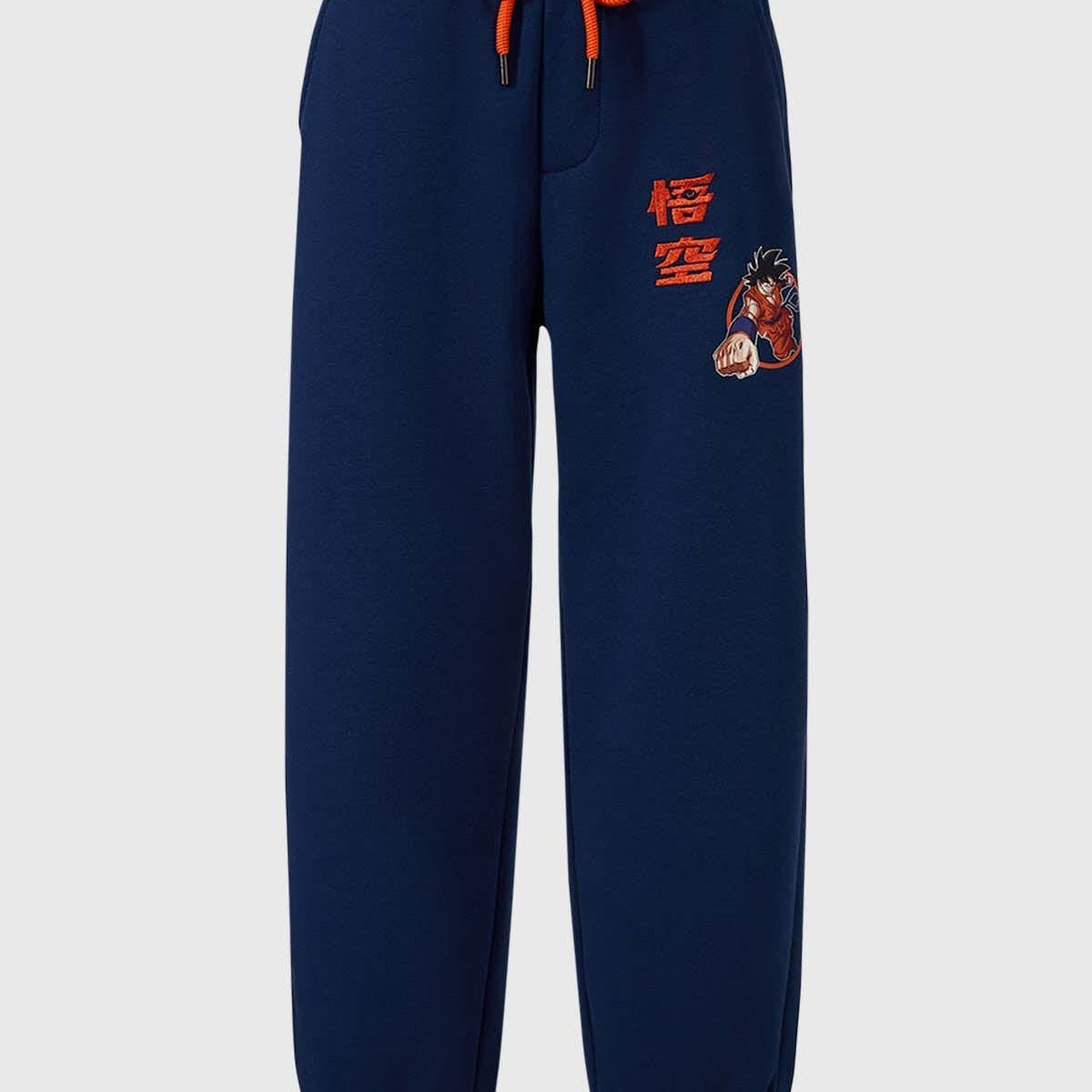 Pantalón buzo niño Dragon Ball azul con estampado y cordones naranjas.
