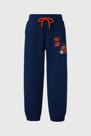 Pantalón buzo niño Dragon Ball azul con estampado y cordones naranjas.