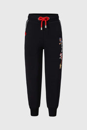 Pantalon buzo negro para niño con diseño de Paw Patrol y detalles en rojo.