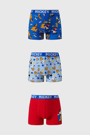 Boxer niño color calipso con estampado de Mickey y Donald en fondo claro.