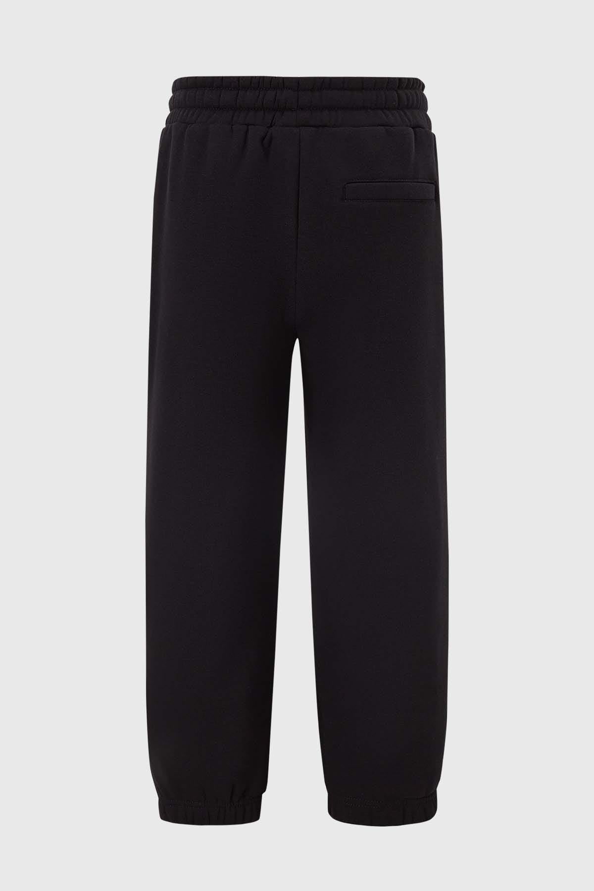Pantalón Buzo Niño Franjas En Bolsillo Negro