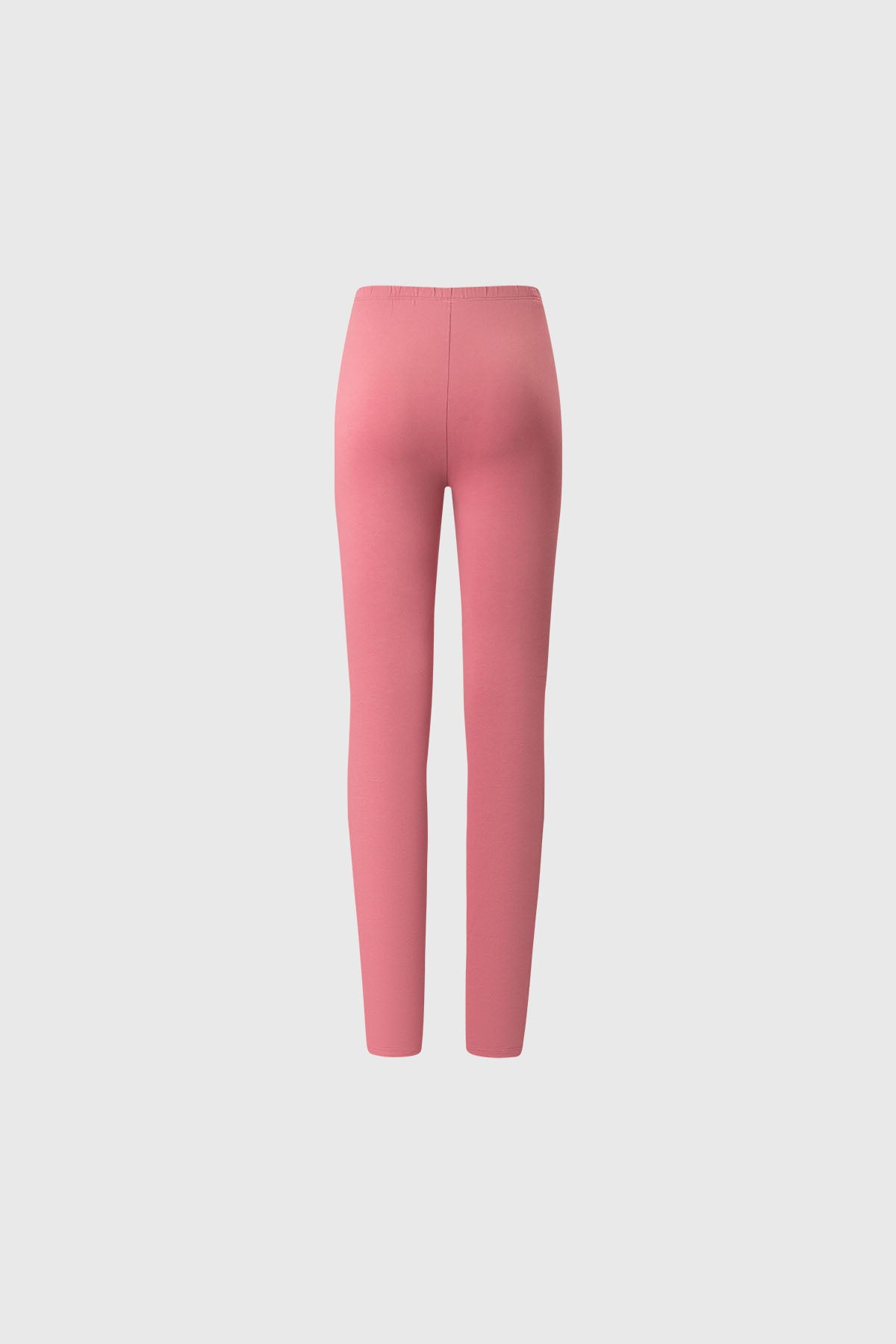 Bipack de calzas para niña con una prenda lisa en color rosado y otra negra con estampado de corazones pequeños