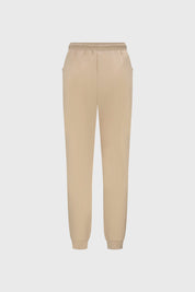 Pantalón buzo beige y negro para niña con bolsillos laterales diseño liso estilo casual ideal para días relajados