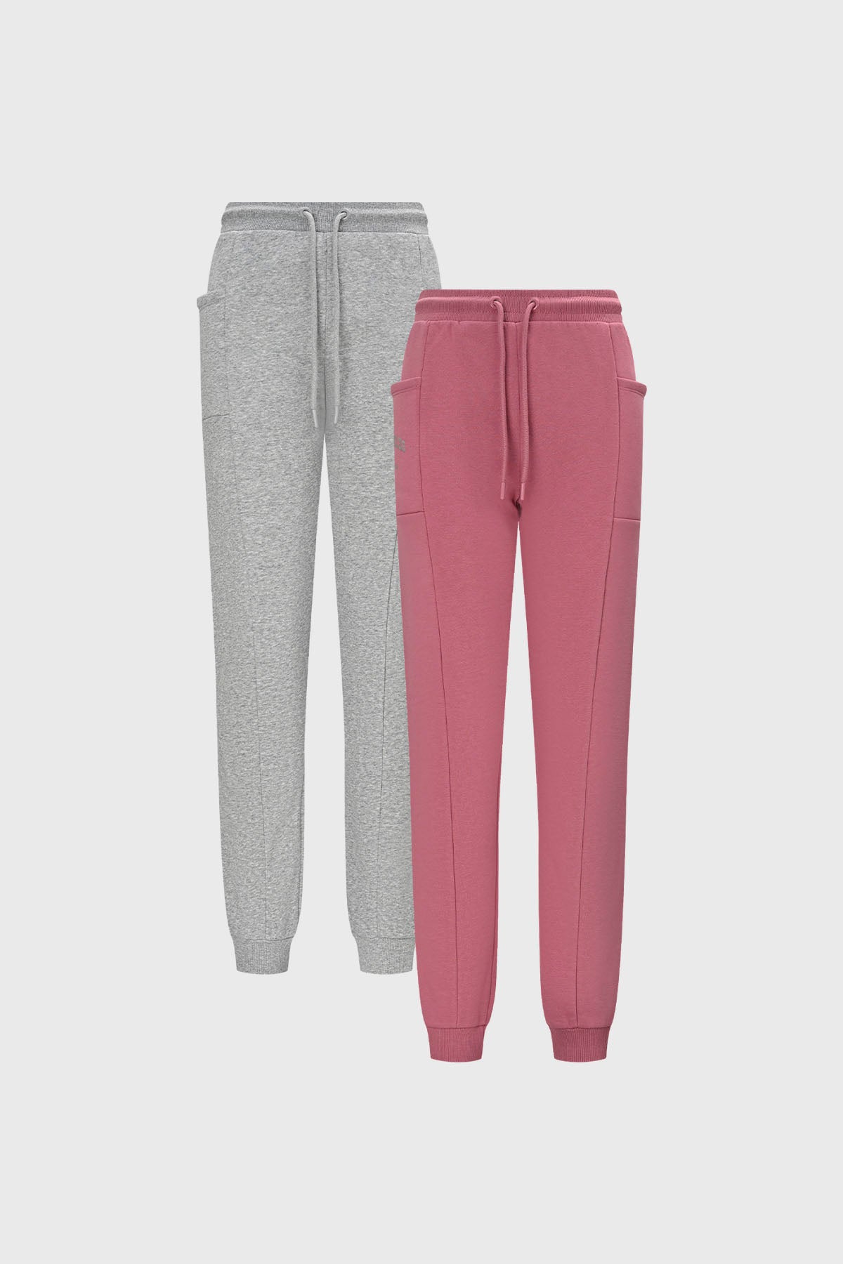 Pantalones buzo niña bipack rosado con ajuste de cordón y bolsillos amplios uno rosado otro gris diseño liso casual