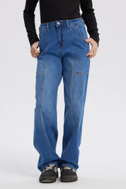 Jeans baggy azul para niña con costuras visibles y corte holgado sin estampa lisa y moderna