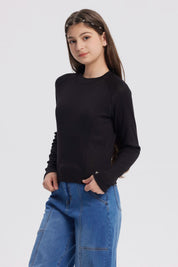 Polera negra para niña de cuello alto parcial manga larga diseño liso ajuste cómodo ideal para días frescos