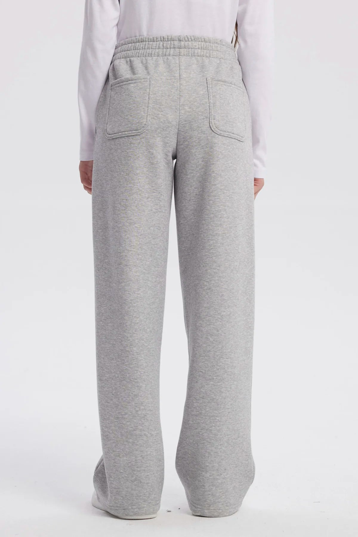 Pantalón buzo niña wide leg gris melange con cintura elástica y bolsillos laterales prenda lisa ideal para comodidad diaria