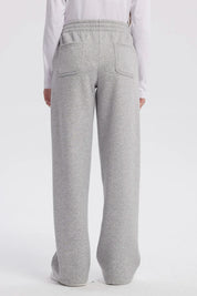 Pantalón buzo niña wide leg gris melange con cintura elástica y bolsillos laterales prenda lisa ideal para comodidad diaria