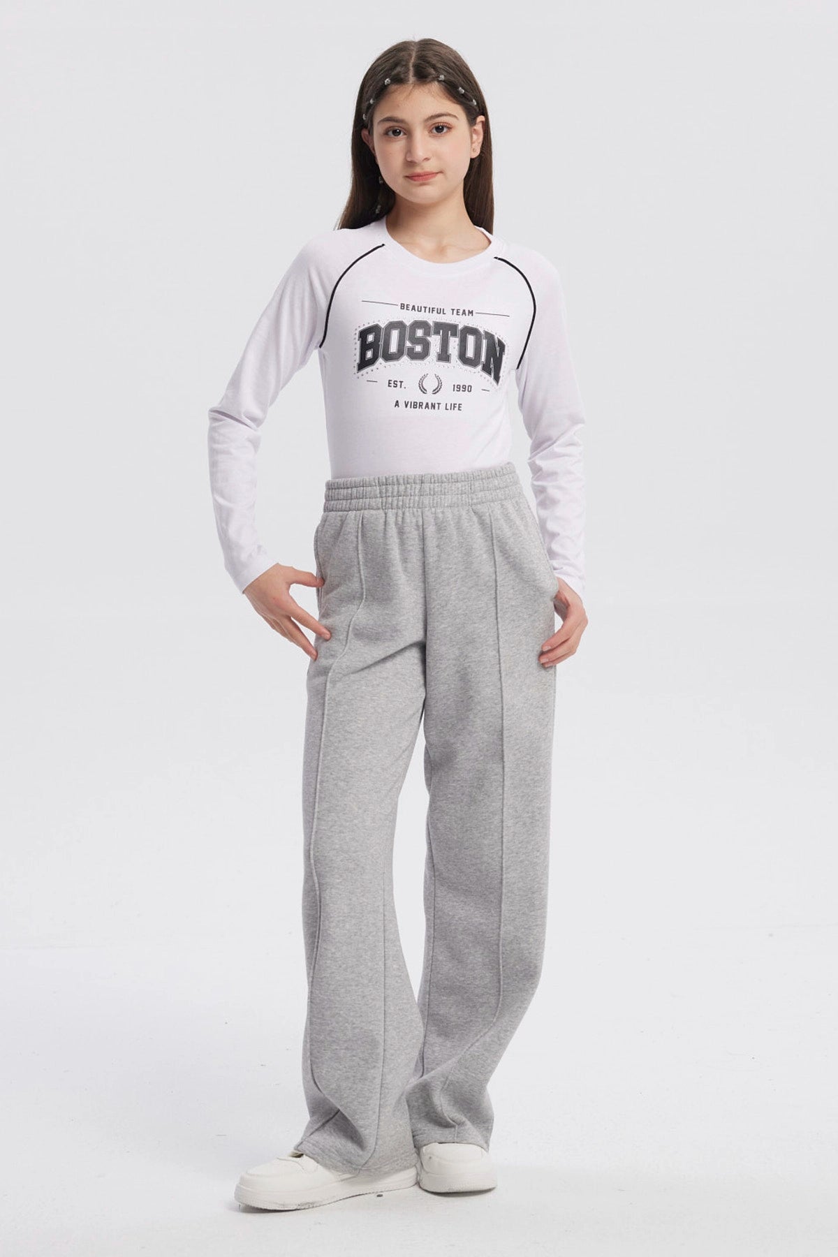 Pantalón buzo niña wide leg gris melange con cintura elástica y bolsillos laterales prenda lisa ideal para comodidad diaria
