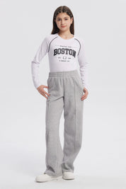 Pantalón buzo niña wide leg gris melange con cintura elástica y bolsillos laterales prenda lisa ideal para comodidad diaria