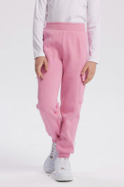 Pantalón buzo pitillo rosado para niña con cintura elástica prenda lisa sin estampa ideal para actividades cotidianas
