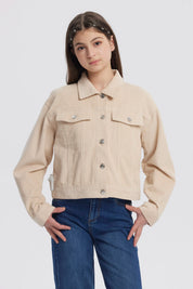 Chaqueta beige de niña estilo slim con cuello camisero y botones metálicos frontales prenda lisa ideal para el frío