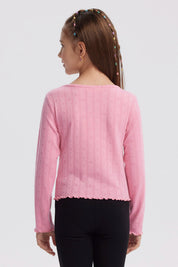 Polera de niña rosada con lazos y pequeños corazones en toda la prenda diseño delicado y manga larga