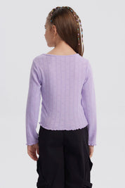 Polera lila para niña con lazos en el escote y diseño de corazones en relieve sin estampa lisa