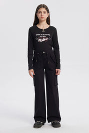 Pantalón cargo niña negro con cordón ajustable y bolsillos laterales amplios diseño liso ideal para el día a día
