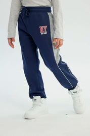 Pantalón Buzo Niño Pitillo Azul Oscuro