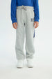 Pantalón Buzo Niño Pitillo Gris Melange Claro