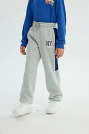 Pantalón Buzo Niño Pitillo Gris Melange Claro