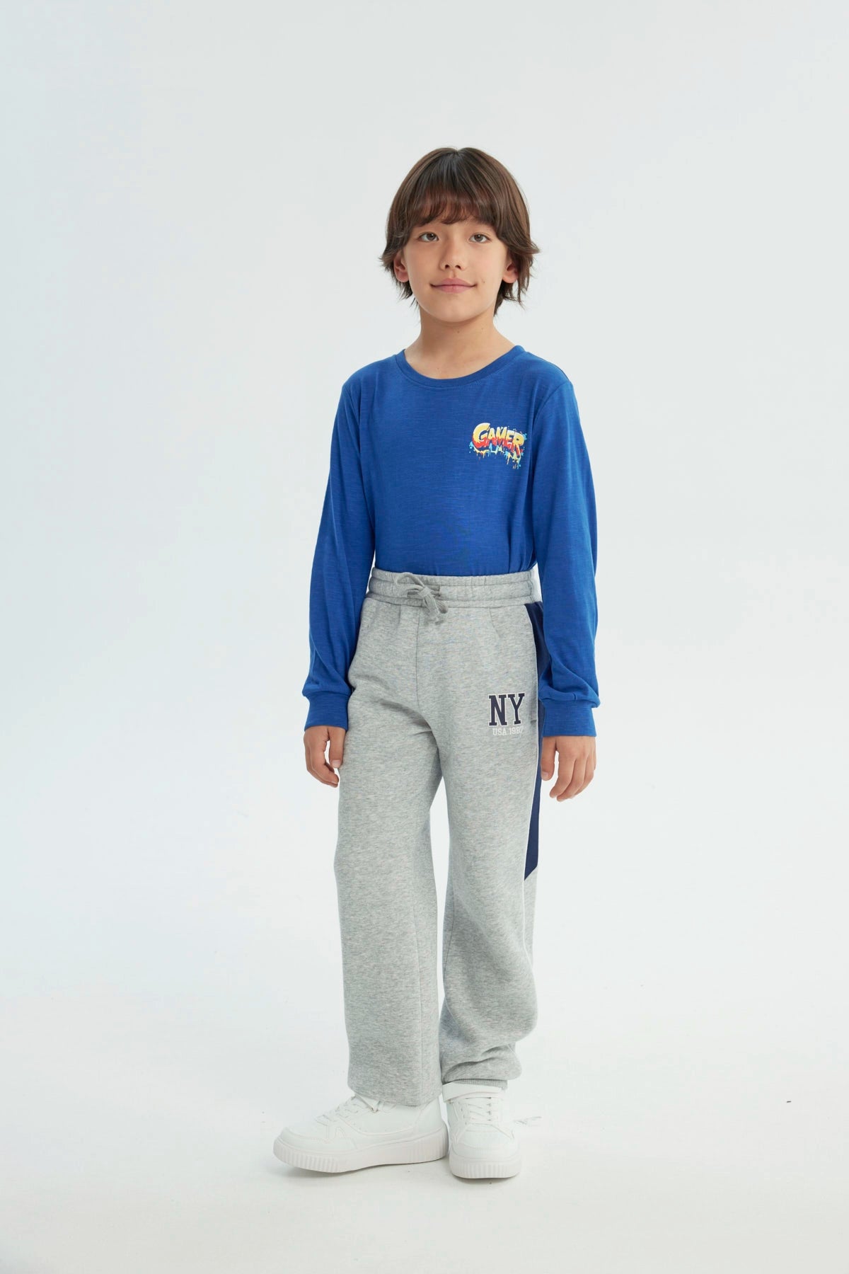 Pantalón Buzo Niño Pitillo Gris Melange Claro