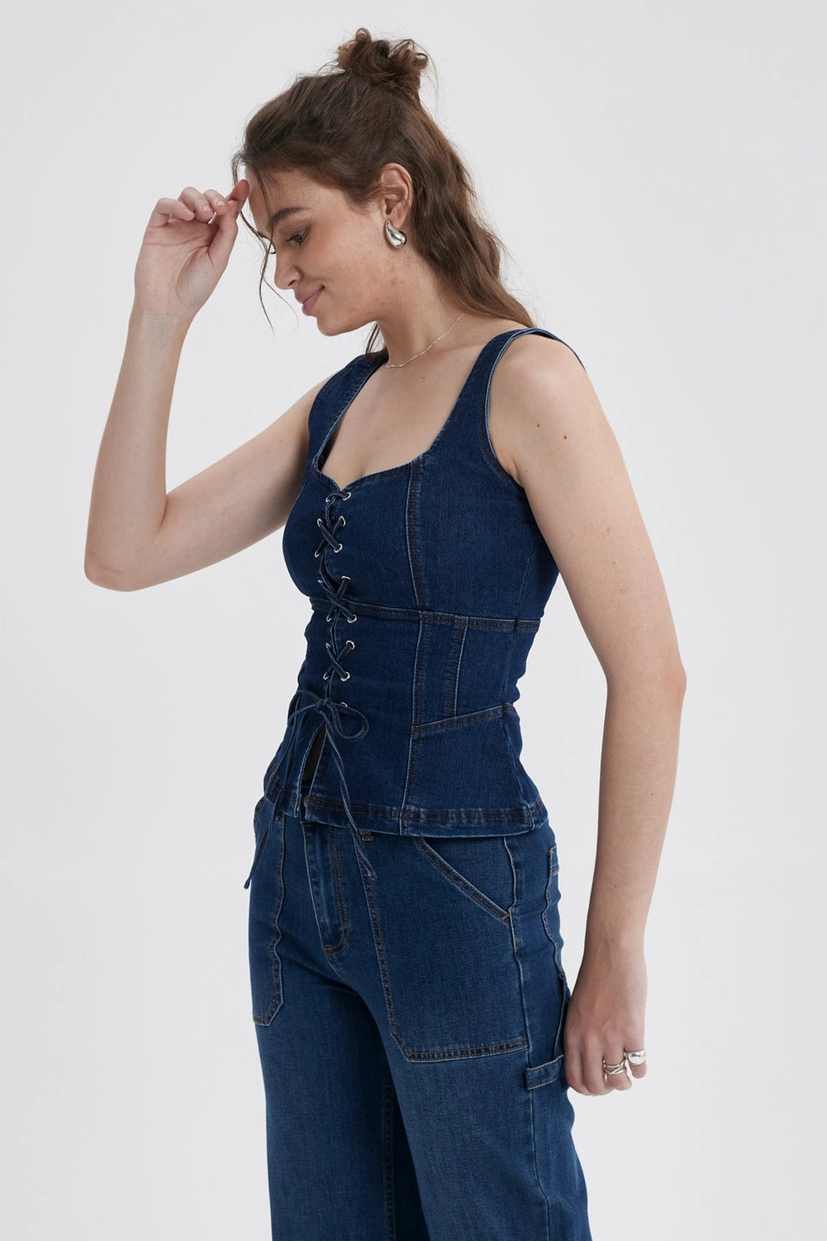 Peto Mujer Corse Peplum Azul con diseño corsé y detalles de cordones frontales