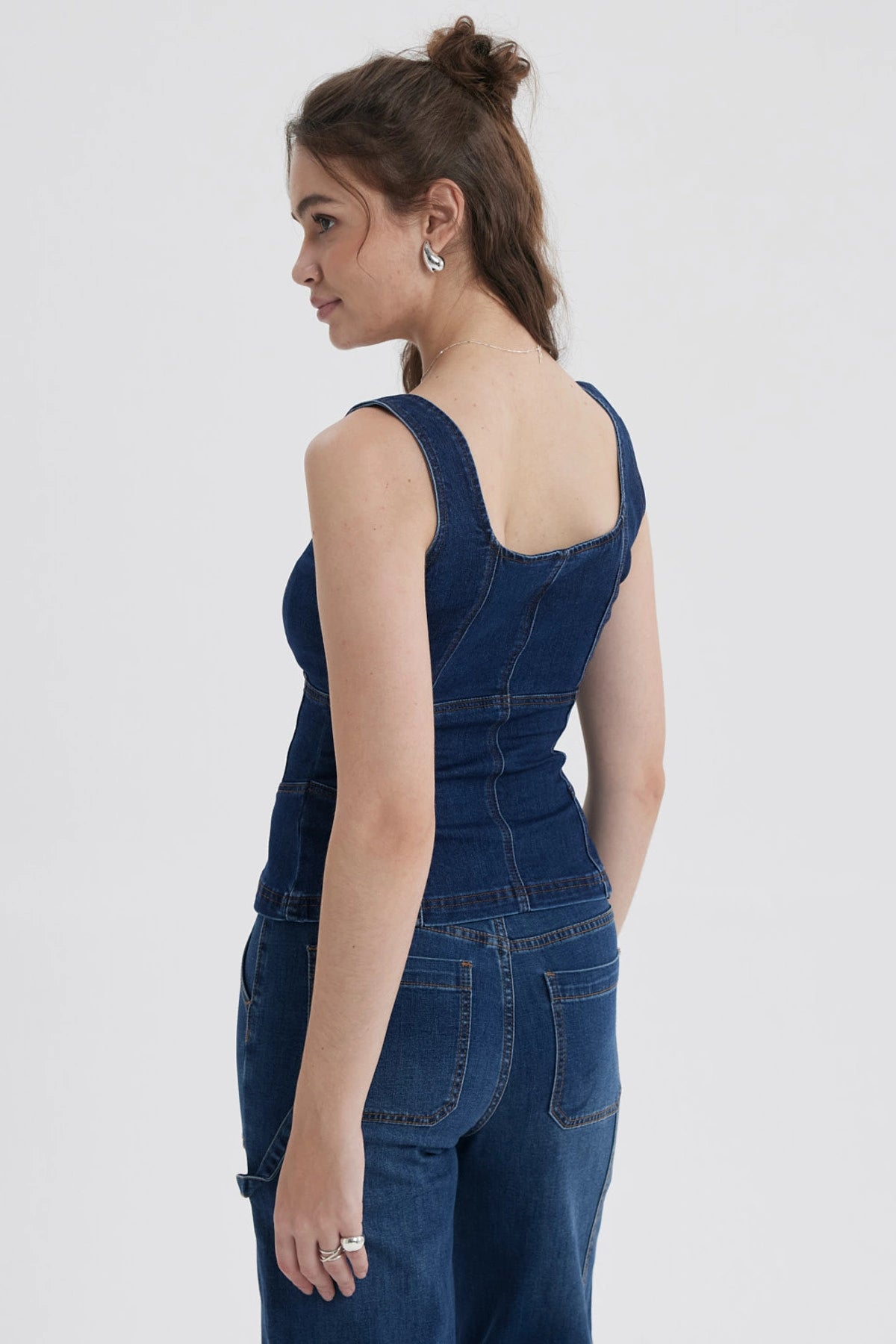 Peto Mujer Corse Peplum Azul con diseño corsé y detalles de cordones frontales