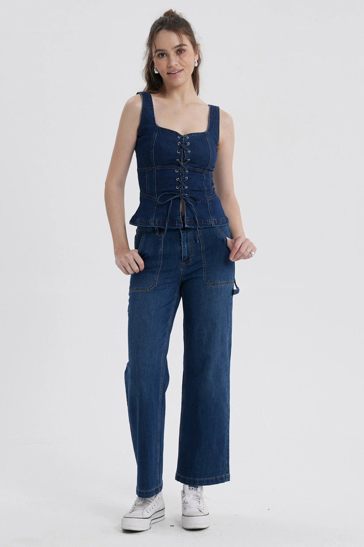 Peto Mujer Corse Peplum Azul con diseño corsé y detalles de cordones frontales