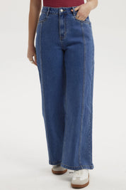 Jeans mujer wide leg azul oscuro con diseño liso costuras visibles estilo casual y corte amplio