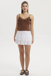 Falda blanca de mujer con capas y lazo ajustable sin estampa visible