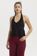 Polera mujer negra tipo halter con lazo en el pecho diseño liso sin estampado ajuste elegante y cómodo