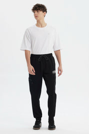 Pantalón Buzo Hombre Pitillo Negro
