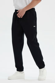Pantalón Buzo Hombre Pitillo Negro