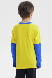 Polera amarilla de niño con estampa de Minions en el frente estilo gráfico mediano con texto Dance Party