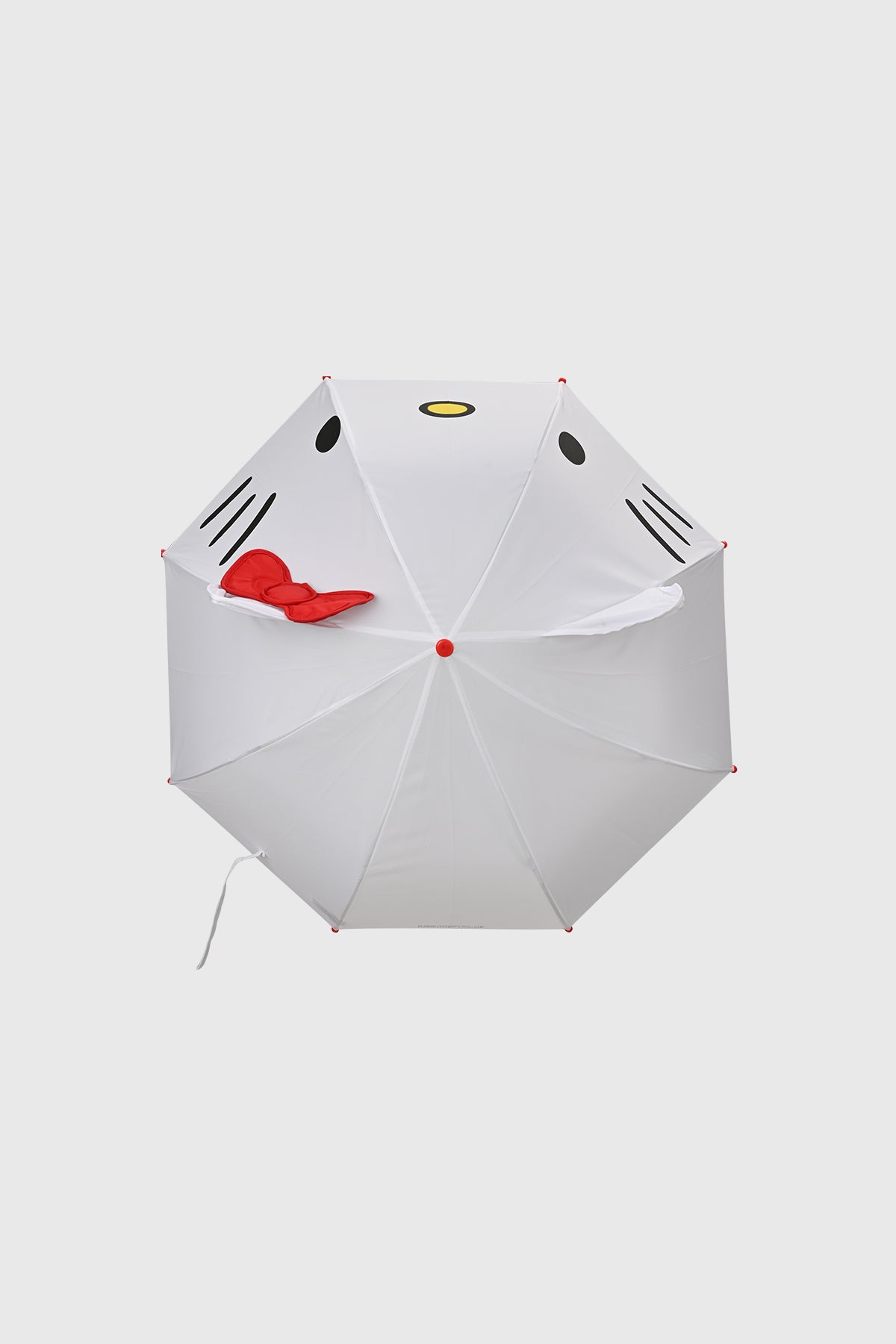 Paraguas blanco con diseño de Hello Kitty en el centro orejas y lazo rojo 3D detalles negros y amarillos
