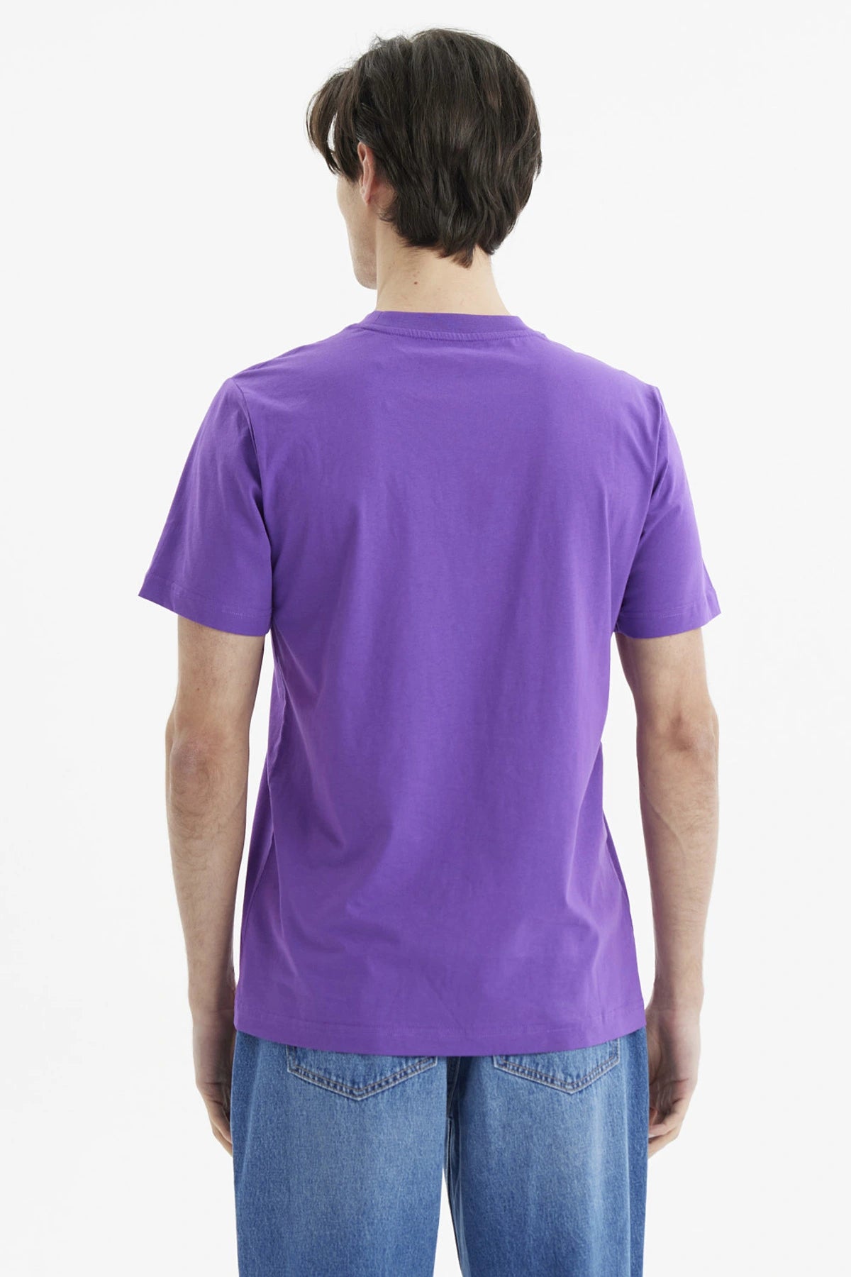 Polera morada de hombre con personaje animado en bicicleta y texto Rocket Power al frente estilo caricatura