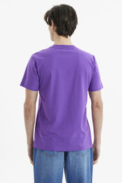 Polera morada de hombre con personaje animado en bicicleta y texto Rocket Power al frente estilo caricatura