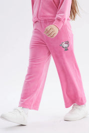 Pantalón buzo rosa niña con Hello Kitty pequeña en la pierna derecha estilo dibujo animado