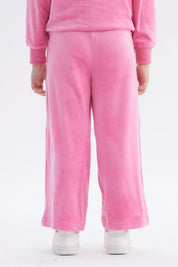 Pantalón buzo rosa niña con Hello Kitty pequeña en la pierna derecha estilo dibujo animado