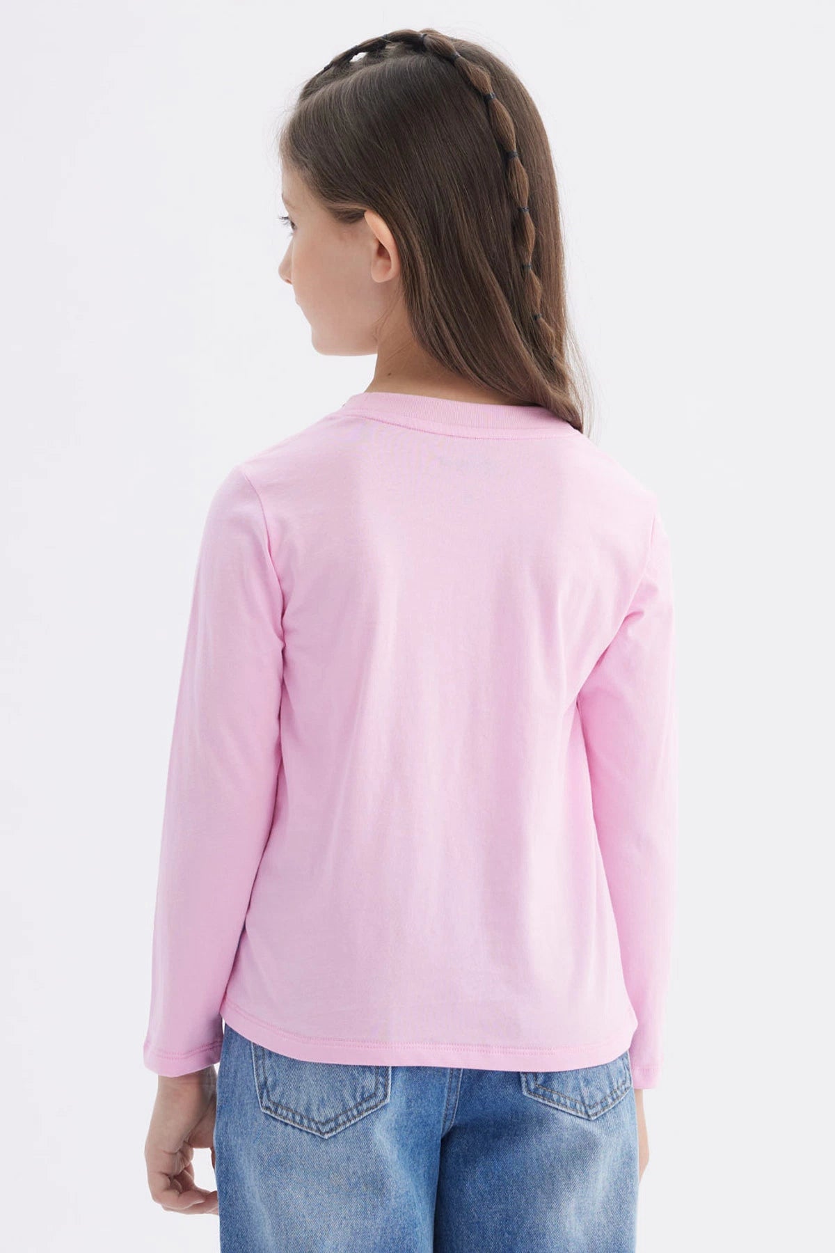 Polera rosada de manga larga para niña con estampado grande de Stitch azul al frente y texto Ohana en estilo animado