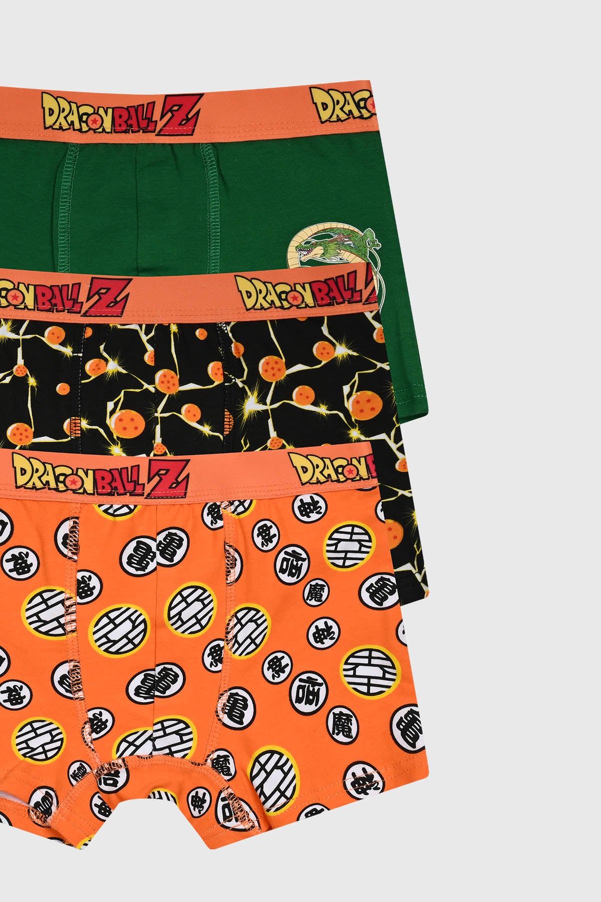Boxer niño tripack color naranjo con estampas de Dragon Ball Z en estilo gráfico anime en la parte frontal