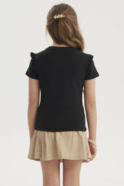 Polera negra para niña con vuelos en los hombros prenda lisa de algodón ideal para un look casual y cómodo