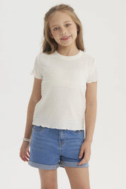 Polera niña crudo con textura lisa y mangas cortas sin estampado